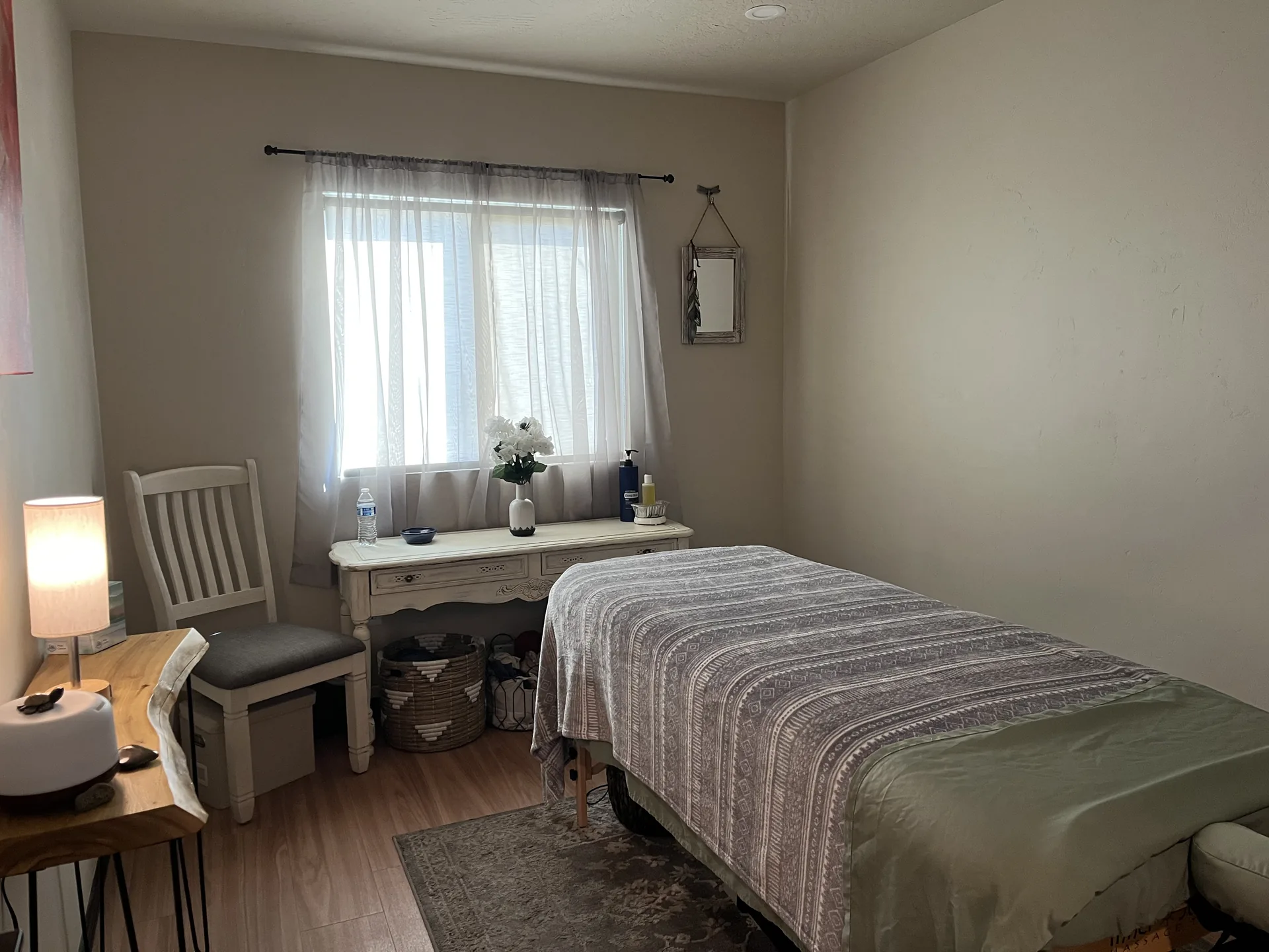 The massage room, with the table made up beside the window